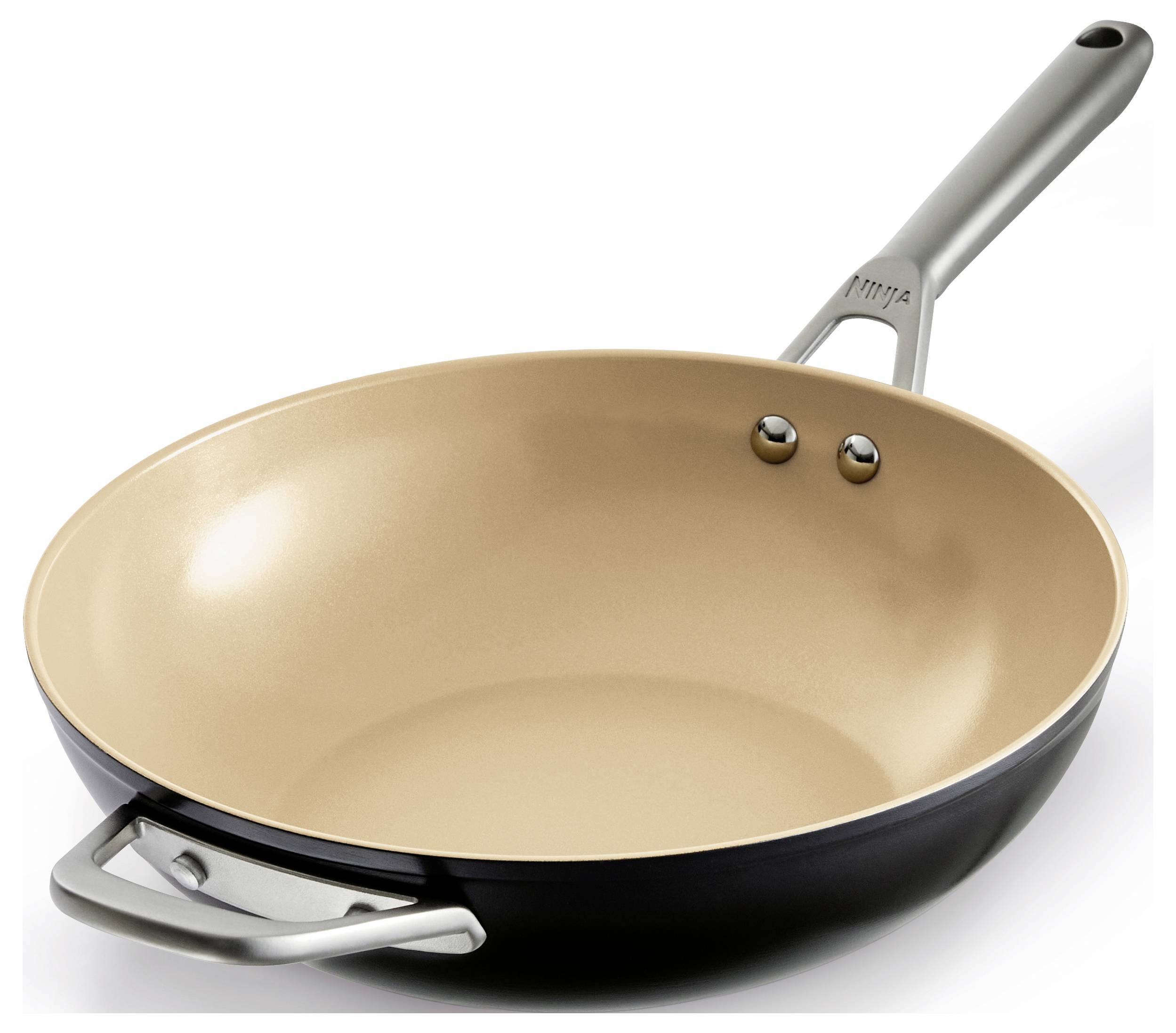 Non-stick frying pan in beige with a silver handle, suitable for cooking and frying.