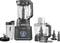 A black kitchen blender with various attachments and a jug marked 'Ninja'. Digital display on the front.
