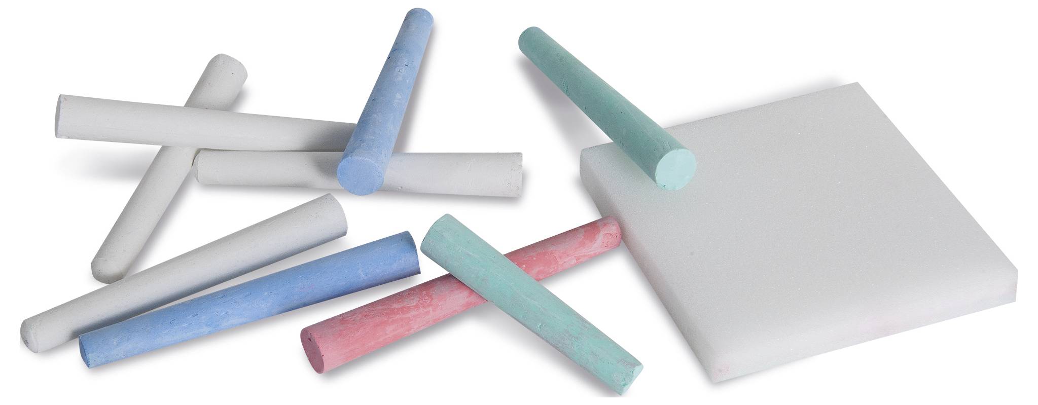 Colourful chalk pieces in blue, pink and white beside a white board eraser, lying on a white surface.