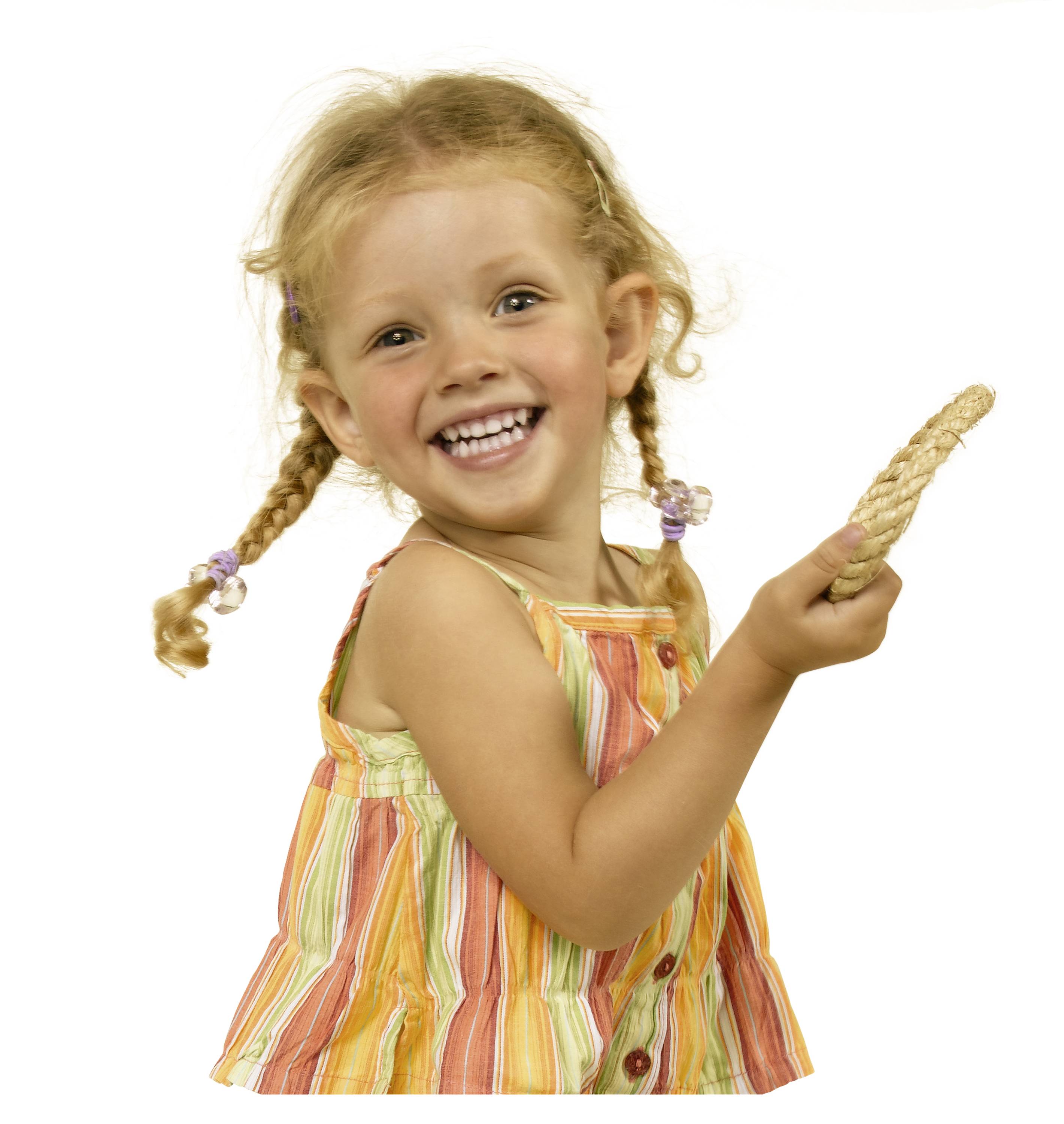 A cheerful little girl with blonde plaits is smiling at the camera. She is wearing a colourful striped summer dress.