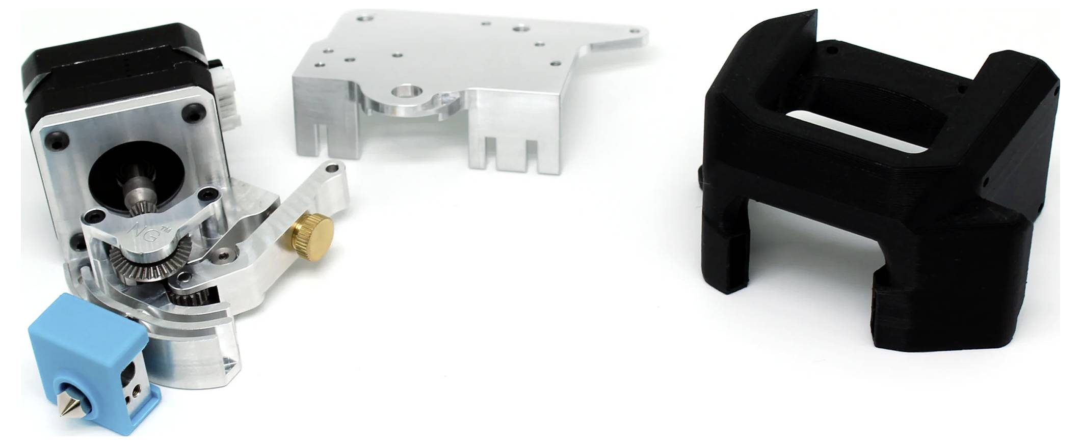 Metal and plastic components of a 3D printer extruder kit on a white background; components shown for assembly.