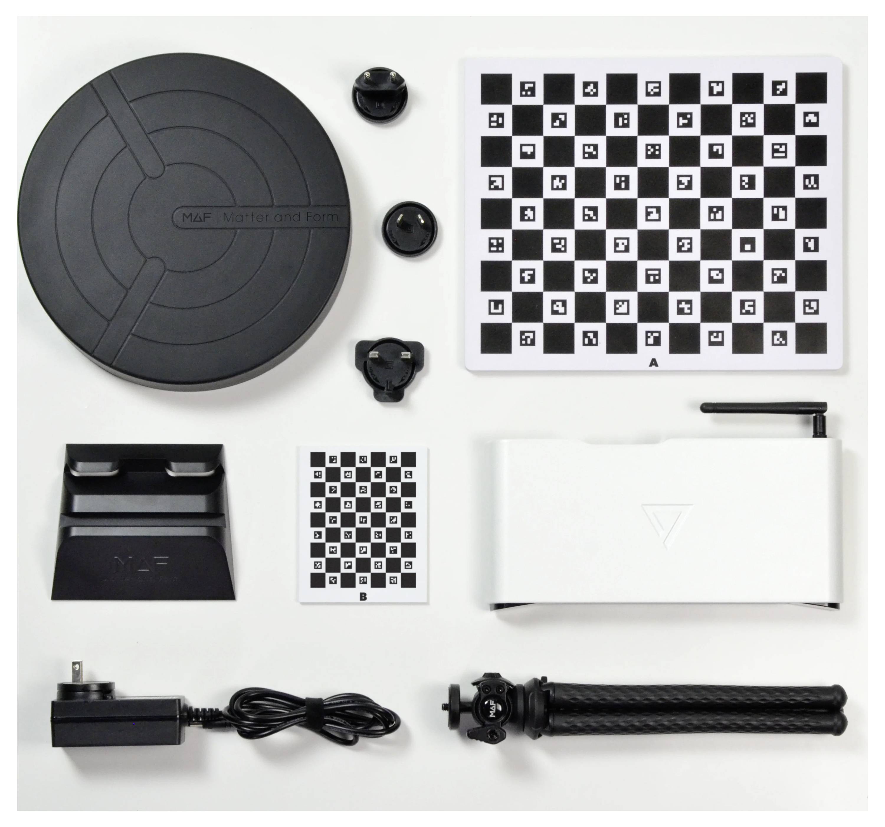 'Calibration kit comprising turntable, calibration charts, stand, mount, power supply and tripod for 3D scanning.'