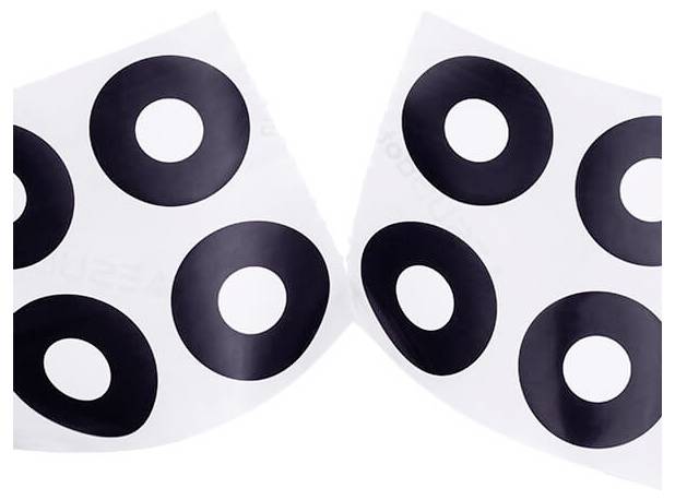 Black and white target stickers with circular patterns on a white background.