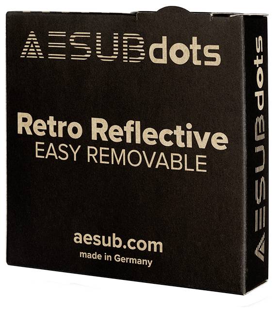 A black cardboard box with the inscription 'AESUBdots', 'Retro Reflective', 'Easy Removable', 'aesub.com', 'made in Germany'.