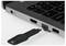 Close-up of a laptop’s side ports with a USB plug being inserted into a port next to the keyboard.<br>
