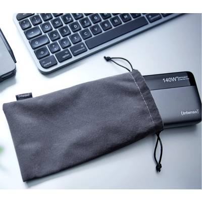 External hard drive 'Intenso' with 140 W power lying partly in a grey pouch; next to it a keyboard on a table.