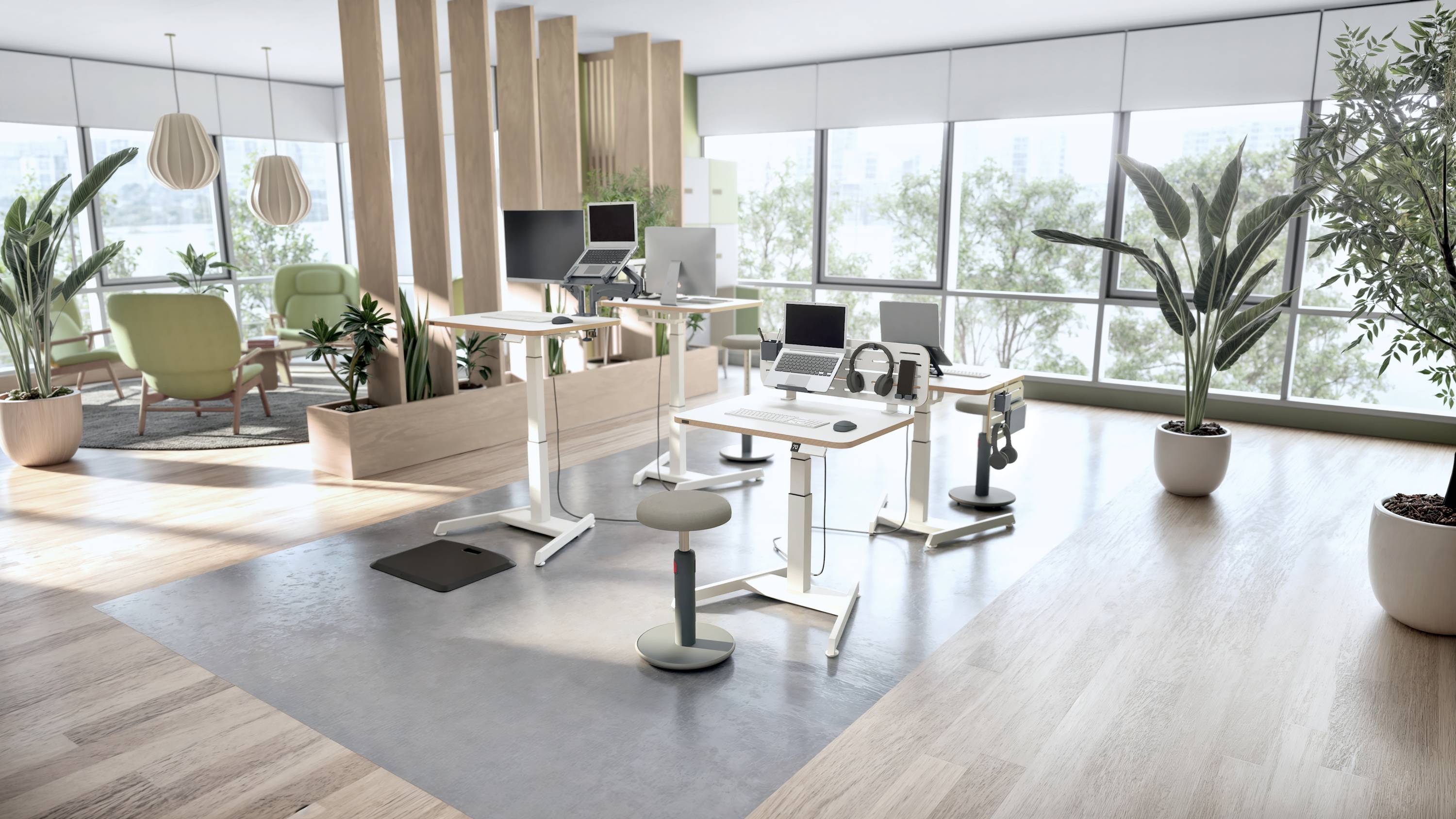 A modern office with large windows, ergonomic desks and chairs, green plants, and stylish lighting.