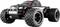 Toy RC truck with large rubber tyres and a black chassis, displaying red details, driving forward on a white surface.