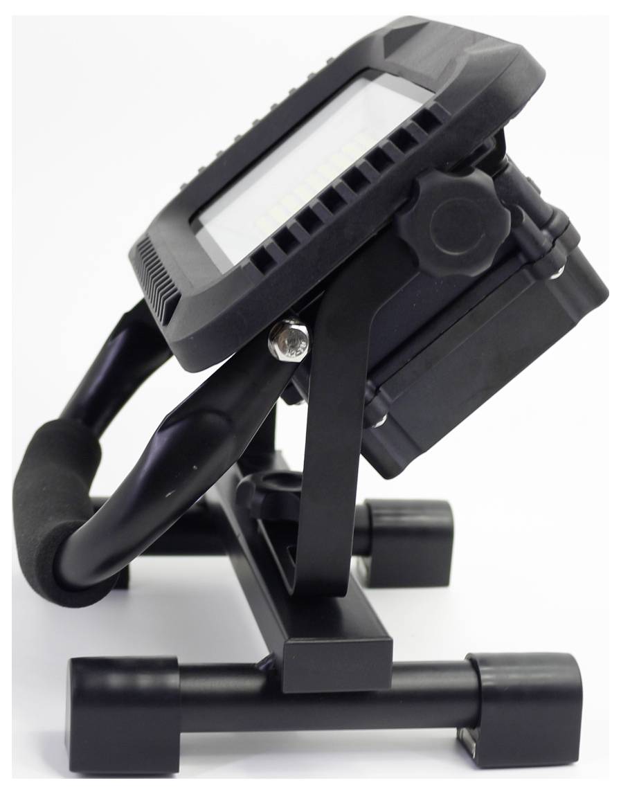 A portable LED floodlight on a stand, viewed from the side, showing the sturdy metal legs and the tilt angle of the light.