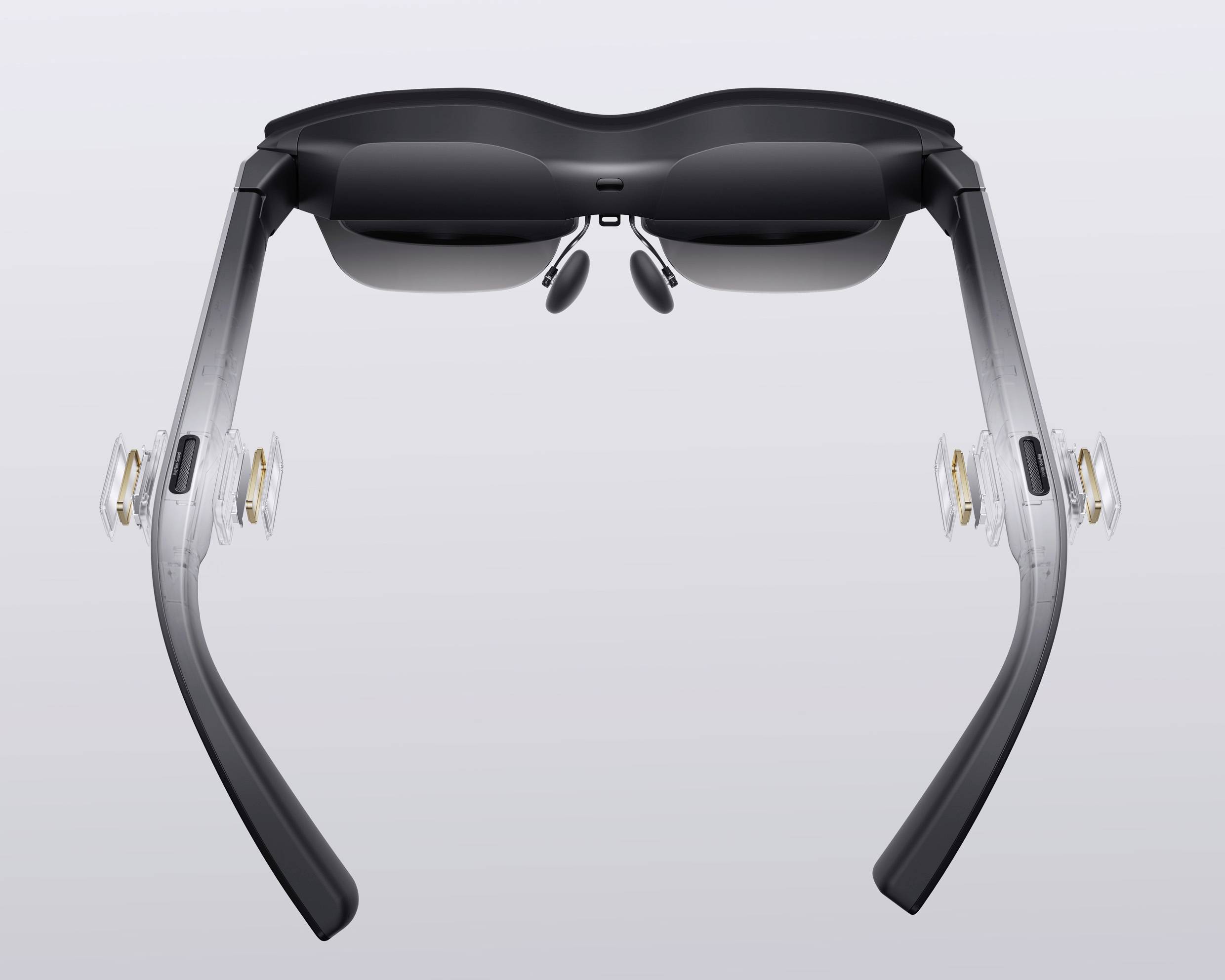 A smart pair of glasses with transparent lenses and side-mounted speakers, perfect for audiovisual experiences and augmented reality.
