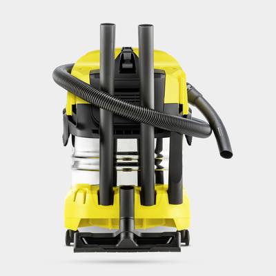 A yellow industrial vacuum cleaner with a black hose and metal tank stands upright. Suitable for use in workshops.