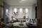 Modern living space with a grey sofa, side table, armchair and subtle decorations. Artworks on the wall, neutral colours.