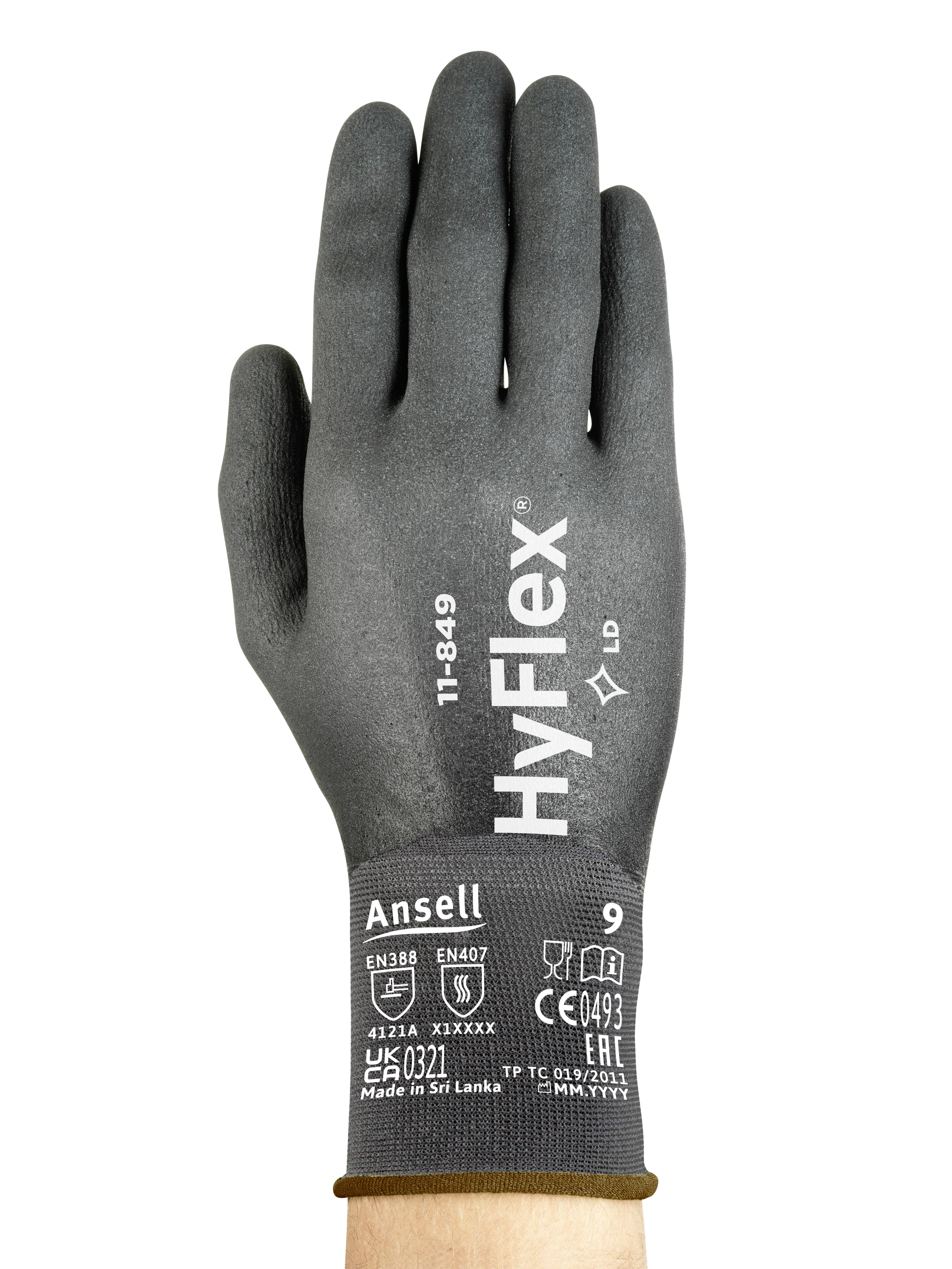 Hand wearing a grey protective glove with "HyFlex" printed on it, showing safety standards and size 9.