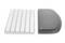 White computer keyboard beside a grey, curved wrist rest on a white surface.