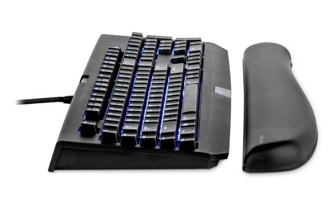 Black ergonomic keyboard with a detachable wrist rest, blue backlighting of the keys, side view.