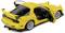 Yellow sports car with an open passenger door and a sporty spoiler. Rear view from the left. Elegant, aerodynamic design.