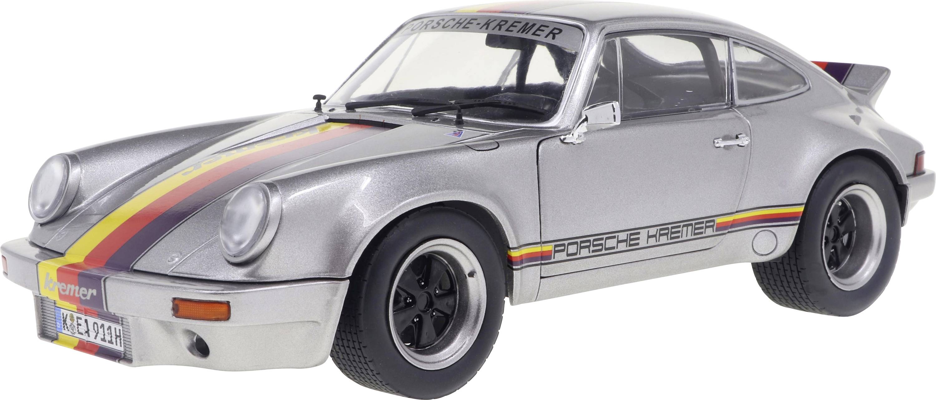 Silver Porsche 911 with black, red and yellow stripes on the bonnet and sides, photographed from a slightly front-left diagonal profile.