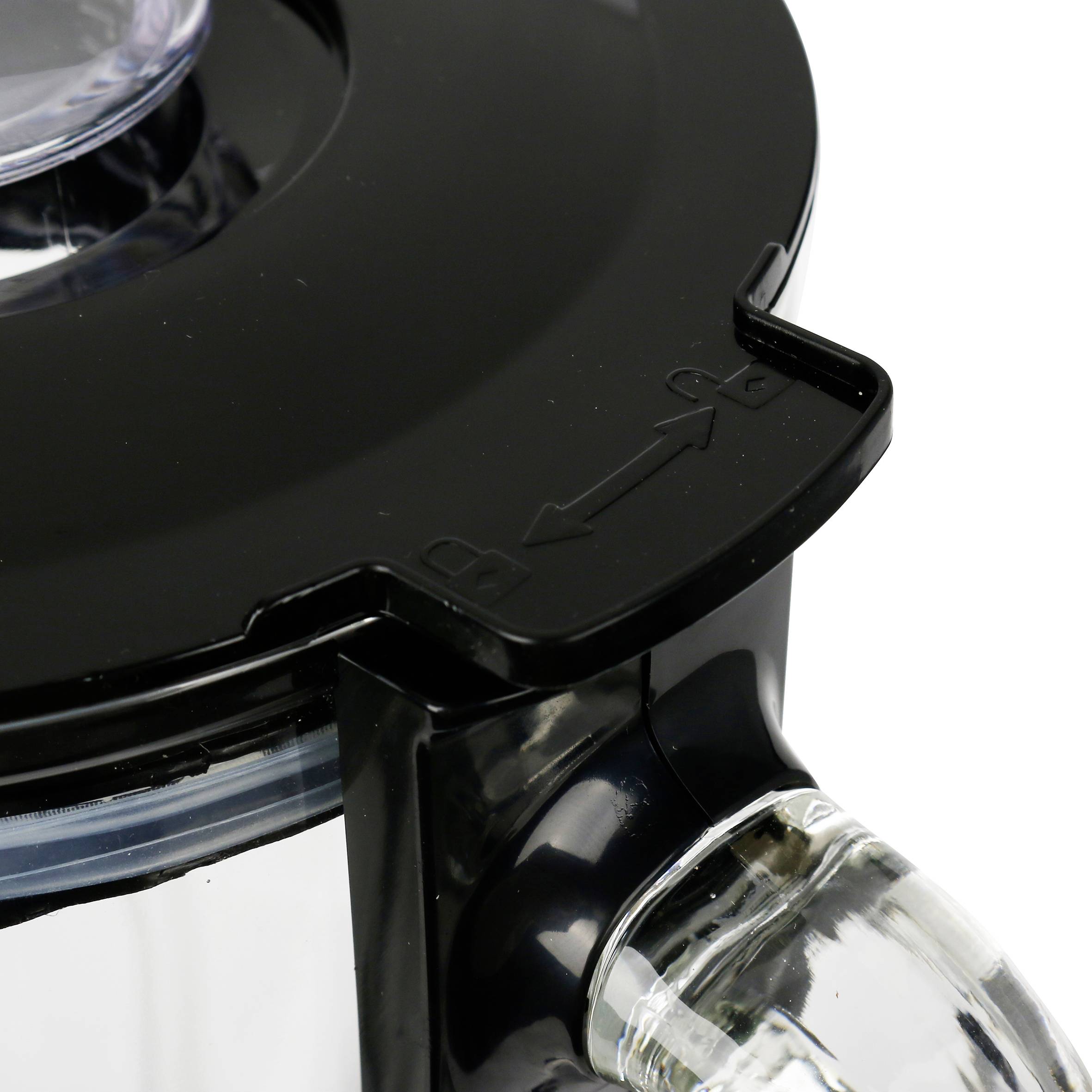 Top surface of a mixer container with a black lid and locking mechanism.