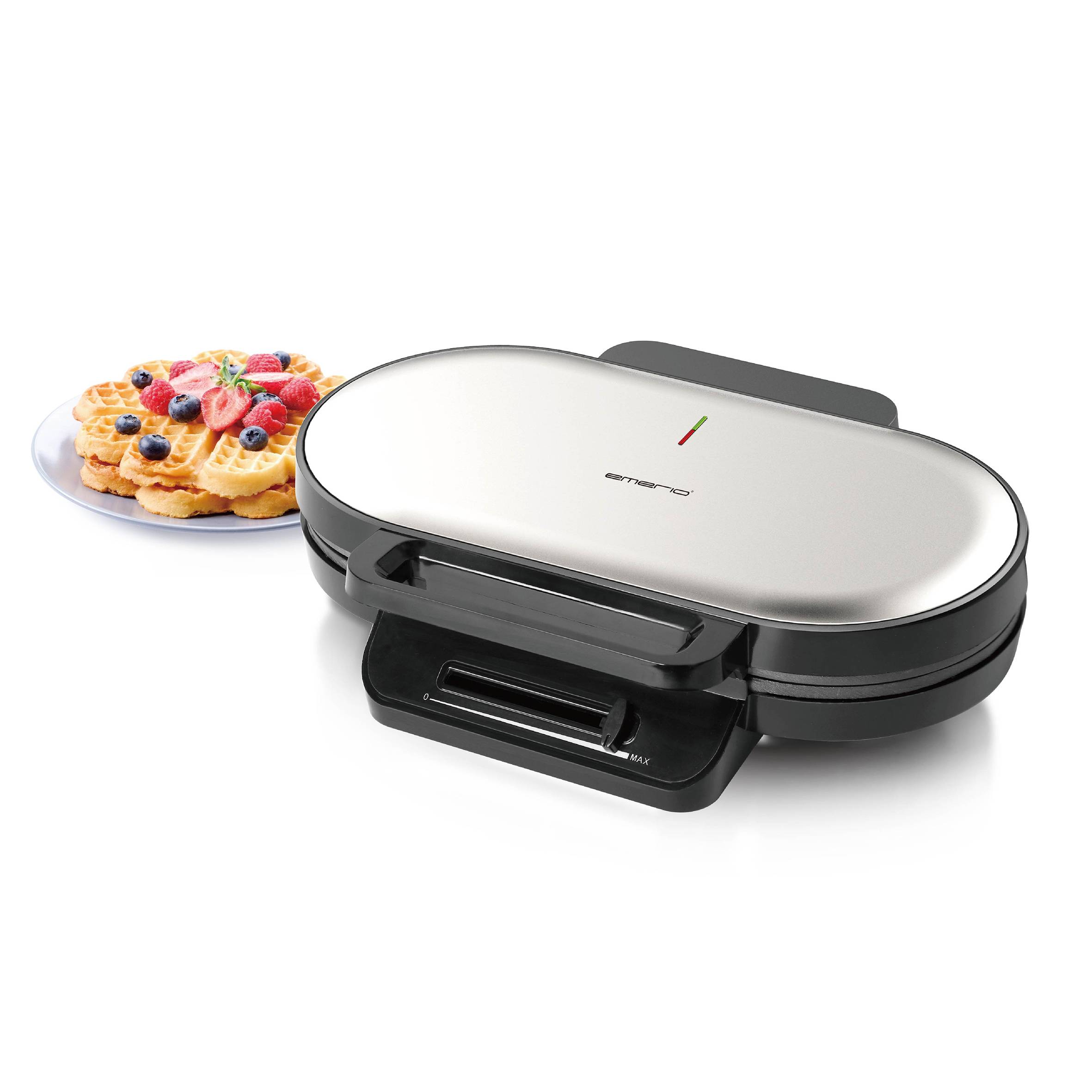 Waffle iron with chrome surface, alongside freshly baked waffles on a plate garnished with berries and mint.<br><br>Waffle iron with a chrome finish, next to golden-brown waffles served on a plate, decorated with fresh berries and a sprig of mint.