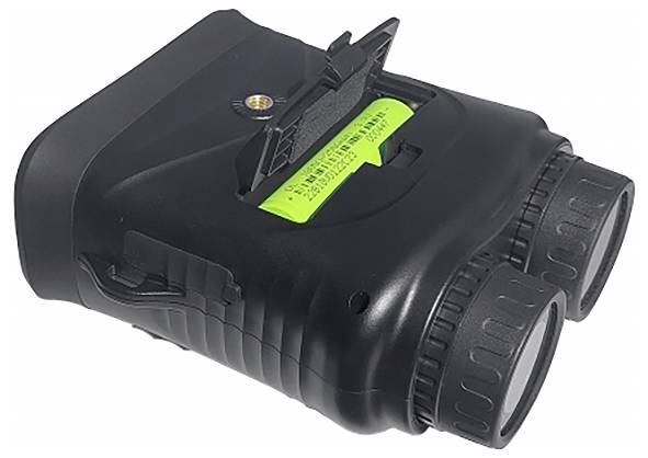 A pair of binoculars with two large lenses and an open battery compartment with a green battery, with text visible on it.