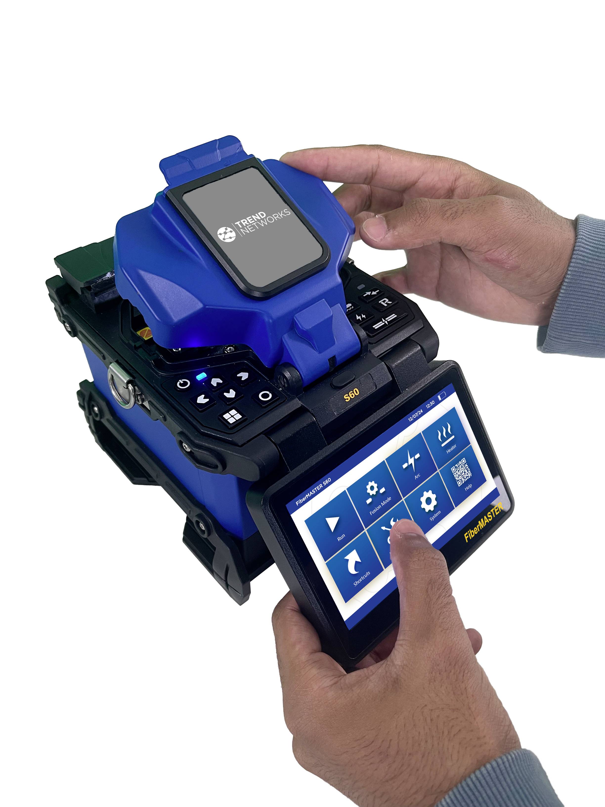 Two hands are operating a device for fibre optic splicing with a screen displaying various equipment configuration options.