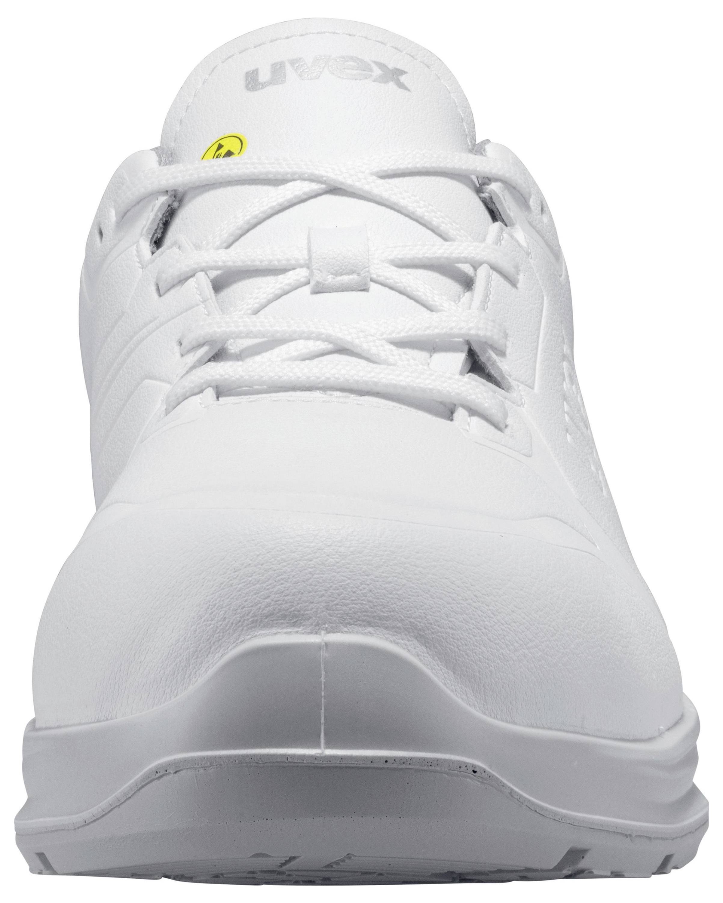 A white, laced work shoe viewed from the front. Upper material made of smooth leather-look fabric with subtle logo embossing and non-slip sole.