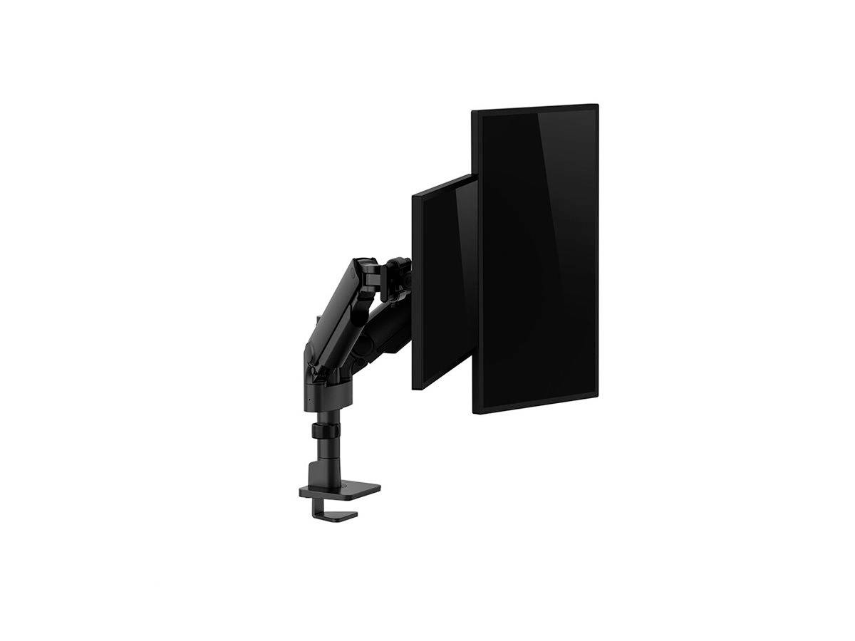 A monitor arm holds a screen; the screen is positioned in portrait orientation. The arm is black and mounted to the desk.