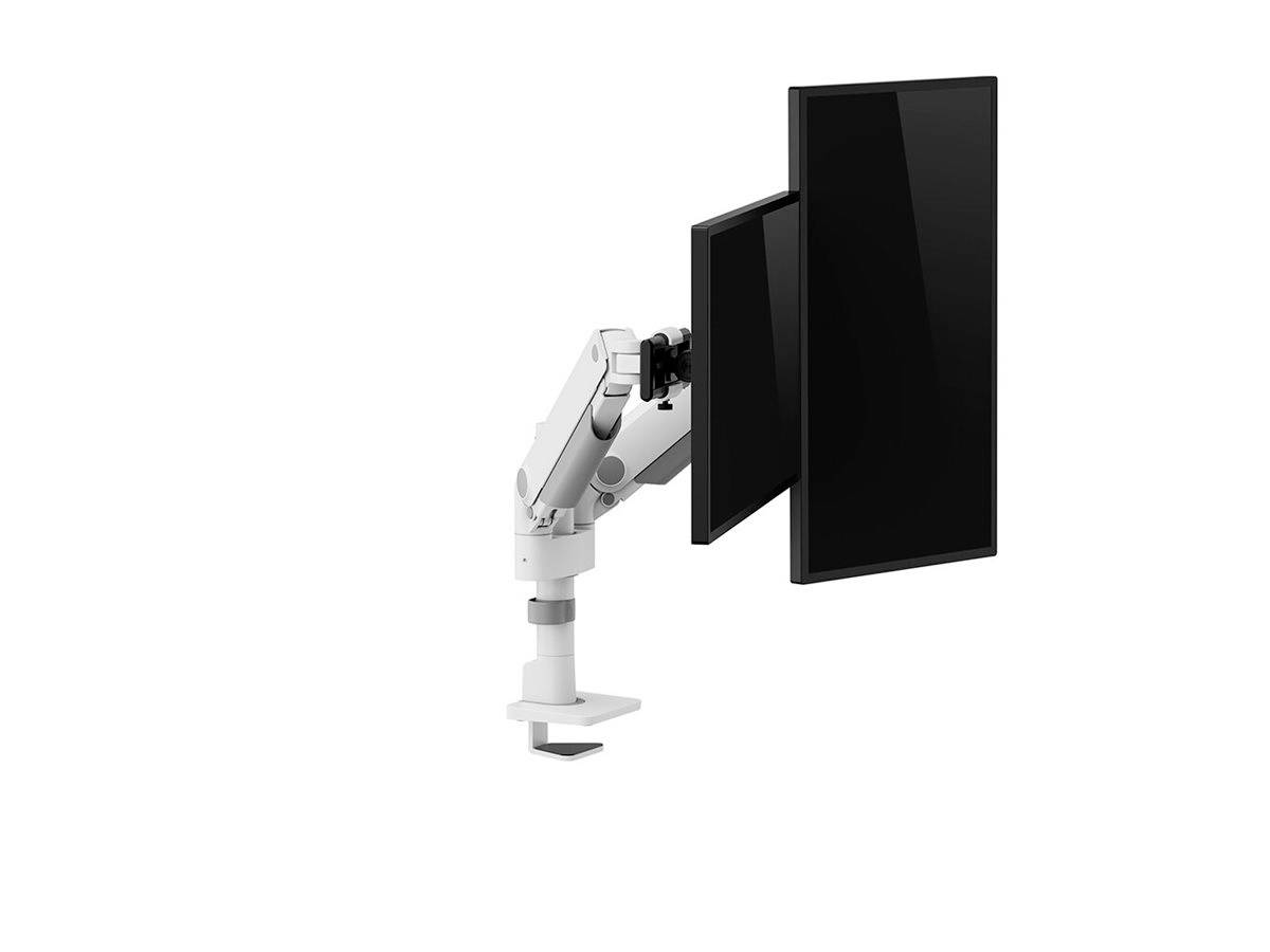 A white monitor arm holds two black screens in vertical orientation, mounted on a desk.