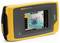 A portable, yellow handheld device with a touchscreen displays an image of a system for acoustic analysis and technical inspection.