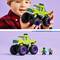 A child is holding a green Lego monster truck model with the inscription 'Hulk Smash!' Beneath it are Lego figures of Hulk and Thanos.