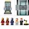 Six LEGO minifigures, including three in superhero outfits, one with a bare torso, one in a suit, and one robot figure, against a high-tech backdrop.