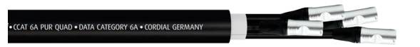 Black cable labelled 'CAT 6A PUR Quad - Data Category 6A - Germany'. Shows the ends of four exposed, shielded conductors.