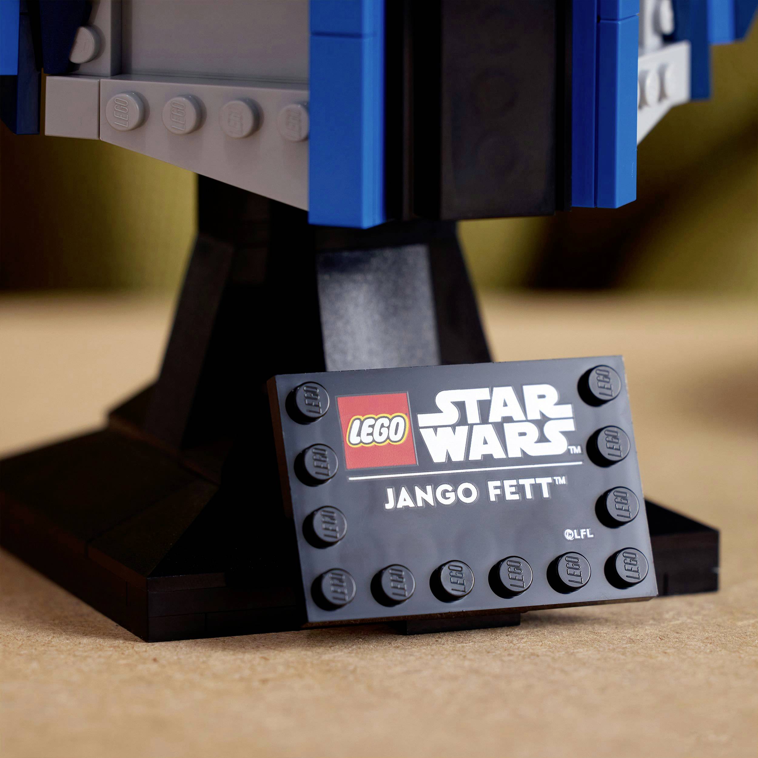 Lego set with 'Star Wars Jango Fett' shield. Focus on the lower part of the figure. Background is blurred.