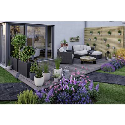 A contemporary terrace with seating furniture, potted plants, flowering blooms along the edge, and a vertical garden wall that enlivens the outdoor atmosphere.