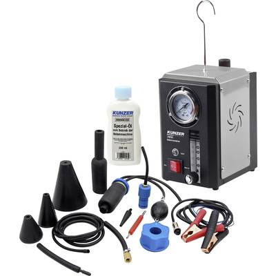 Advertisement for a vehicle smoke leak detector with accessory parts, a bottle of special oil and various hoses for detecting leaks.