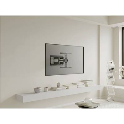 A stylish living room with neutral colours. On the wall hangs a television set not shown as activated, mounted using a complex mounting system.