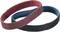 Two grinding belts, one red and one blue, intersect. They are used for grinding materials.