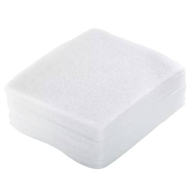 A stack of white paper napkins, square and neatly stacked.