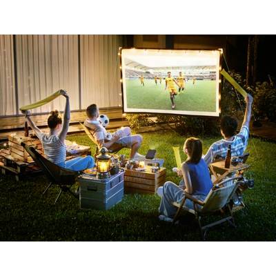 Four people are watching a football match on an outdoor screen in the garden. One is holding foam clappers, snacks and drinks nearby.