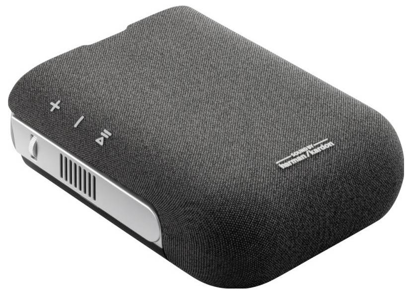 Black portable speaker with fabric covering, brand logo, and volume and playback controls on the top surface.