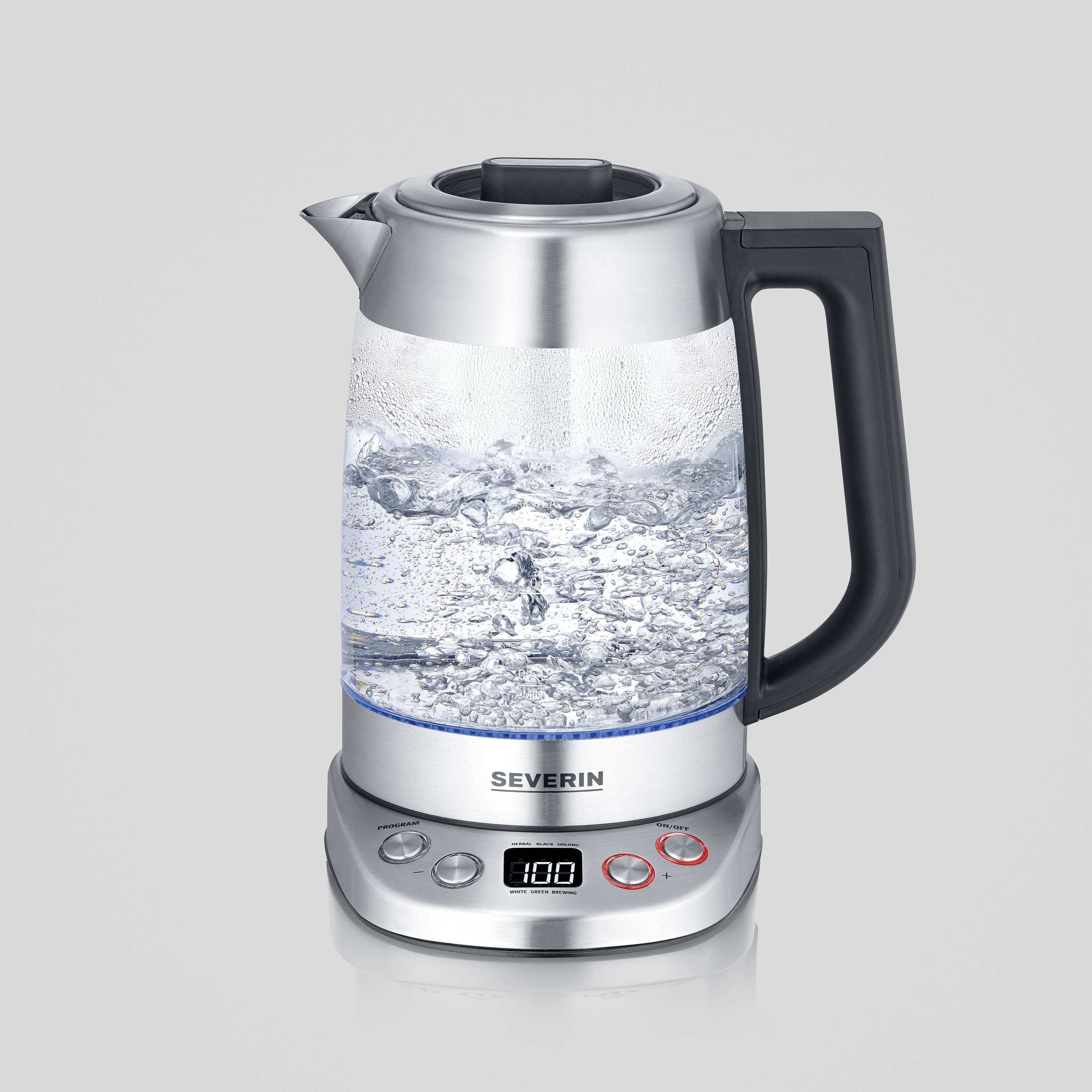 A glass and stainless steel electric kettle with a digital display and buttons. Water boils vigorously inside.