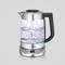 A glass and stainless steel electric kettle with a digital display and buttons. Water boils vigorously inside.
