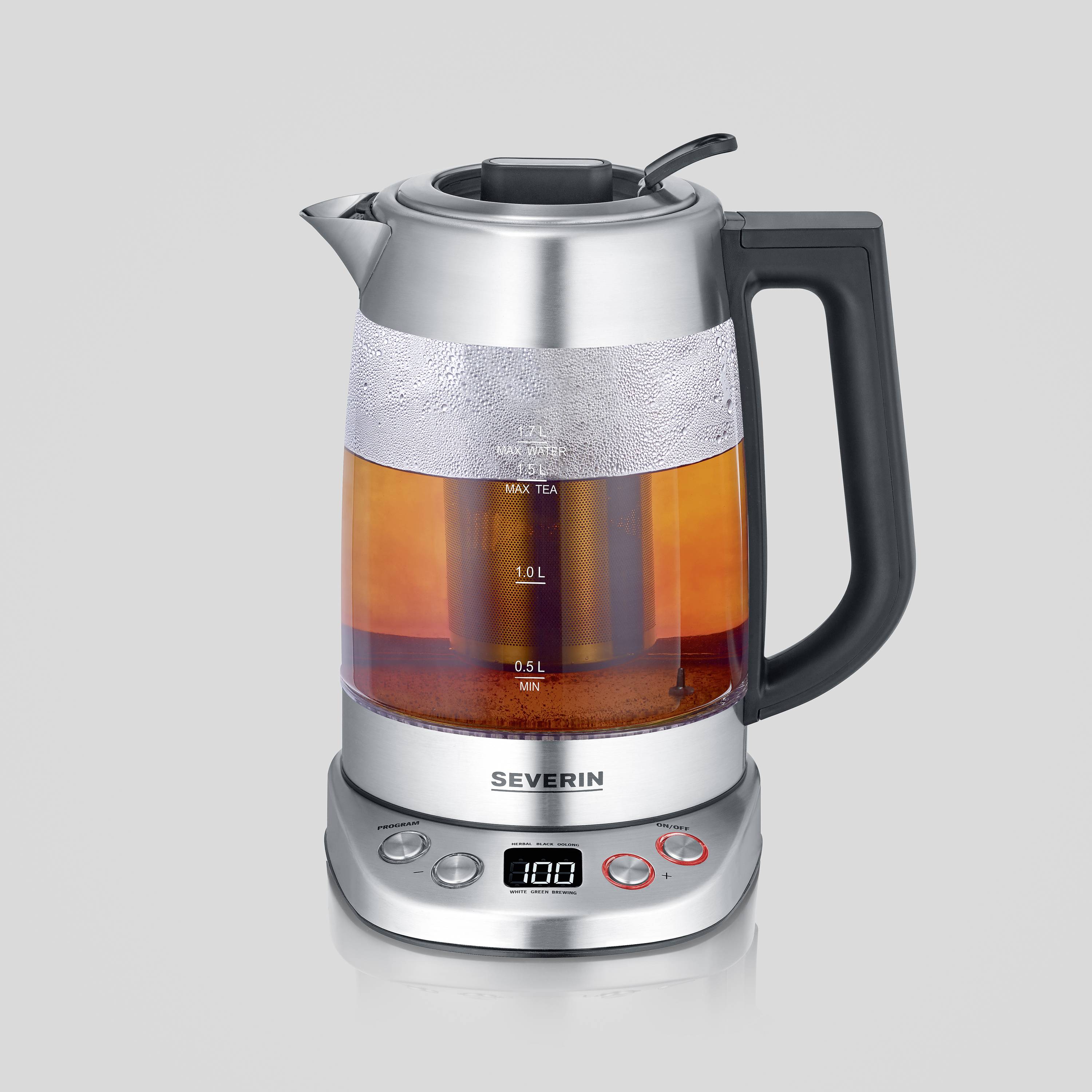 A glass and metal electric kettle, half-filled with water. Digital display and control buttons visible on the base.