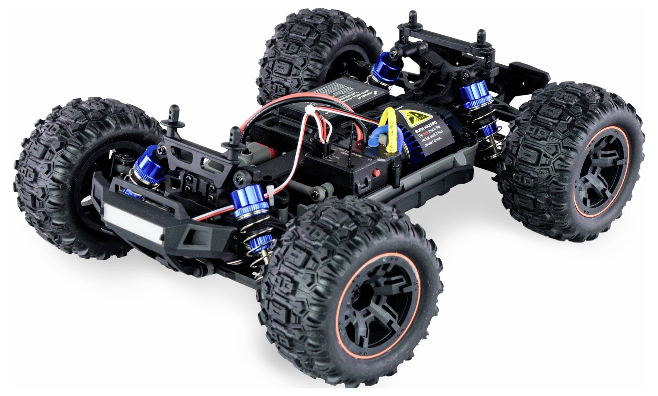 Remote-controlled car with large tyres and visible wiring on an uneven chassis. Front and rear suspension visible.