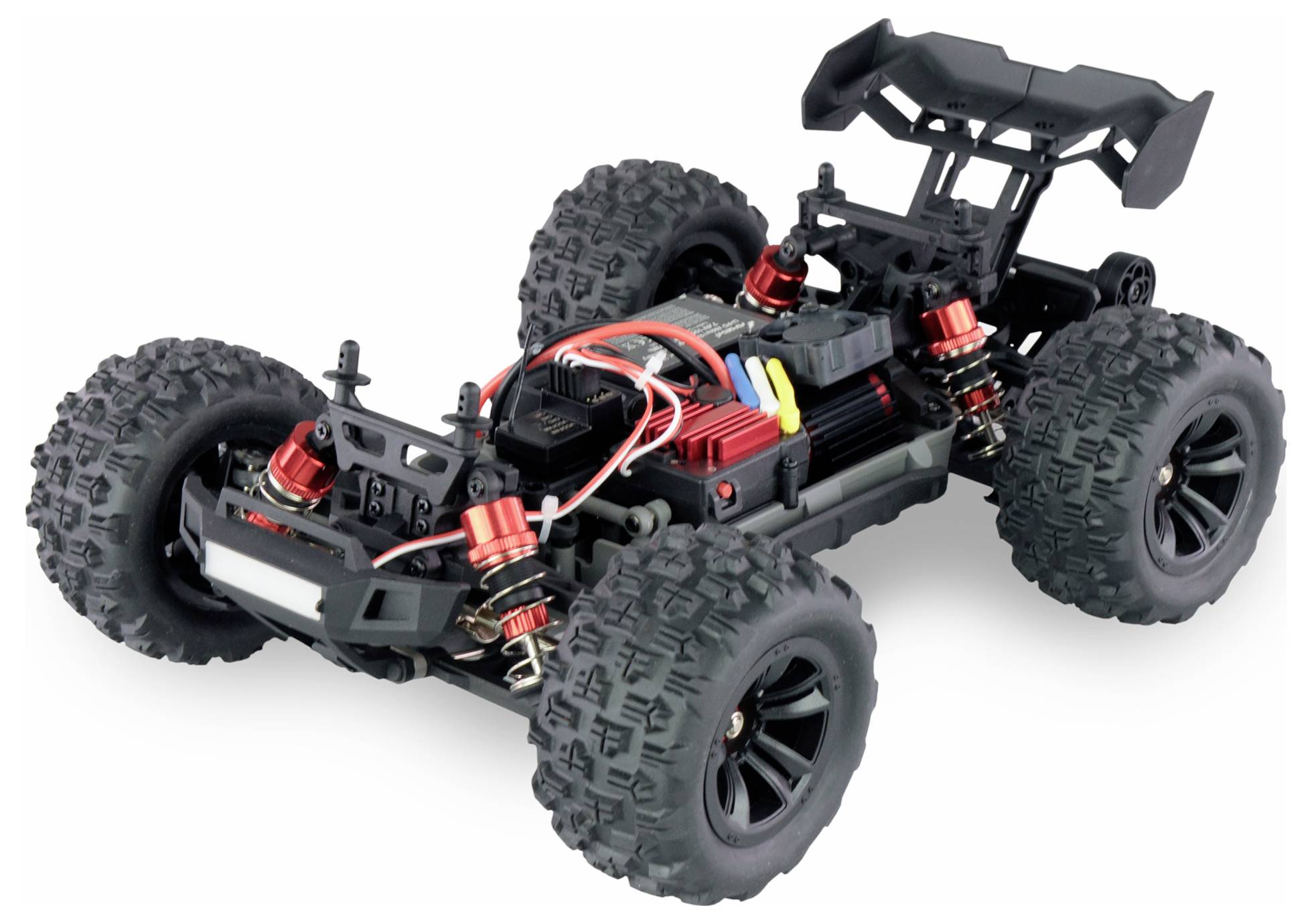 A remote-controlled car without bodywork, revealing wheels, suspension, and electronic components.