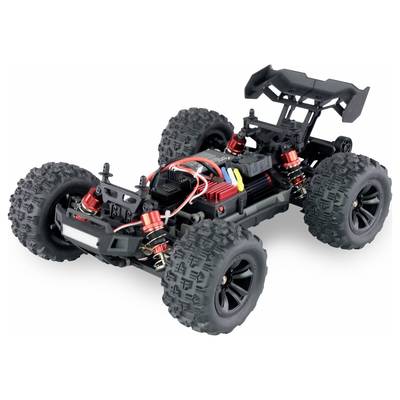 A remote-controlled car without bodywork, revealing wheels, suspension, and electronic components.