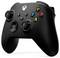 A black gaming controller with colourful buttons (X, Y, A, B) and two analogue sticks, typically used for a games console.