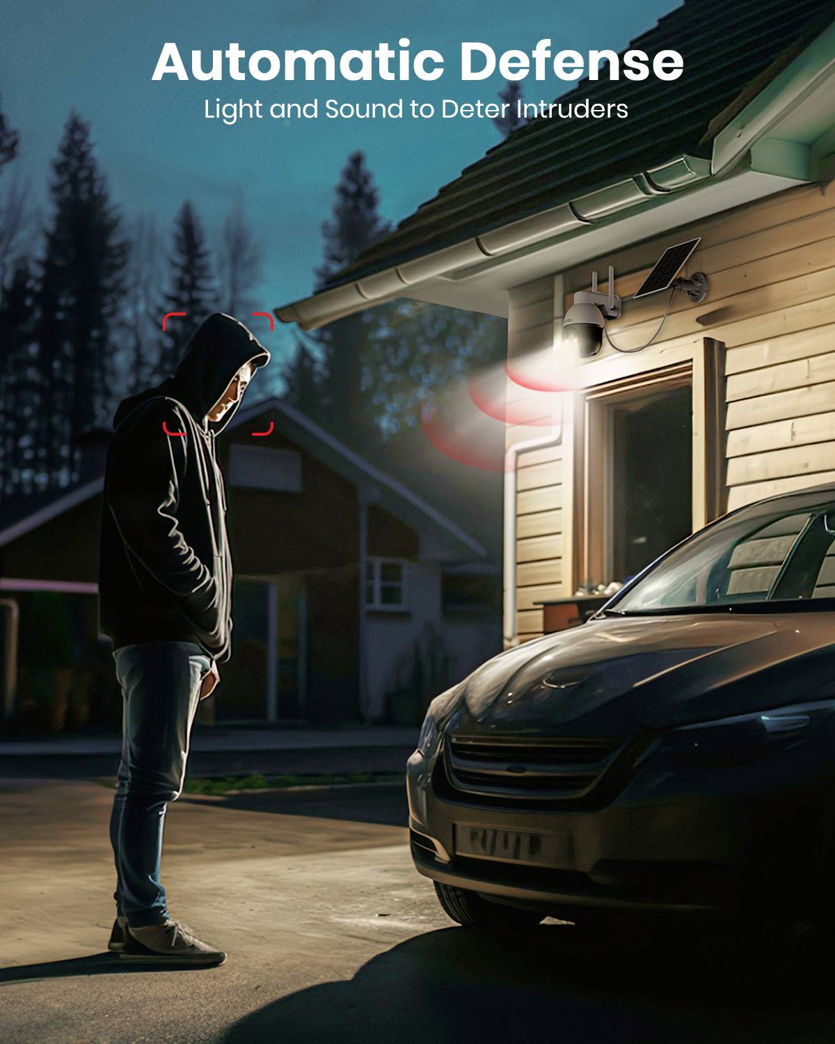 A man in a hoodie stands in an illuminated area in front of a house with car headlights. Text at the top: 'Automatic Defence: Light and Sound to Deter Intruders'.