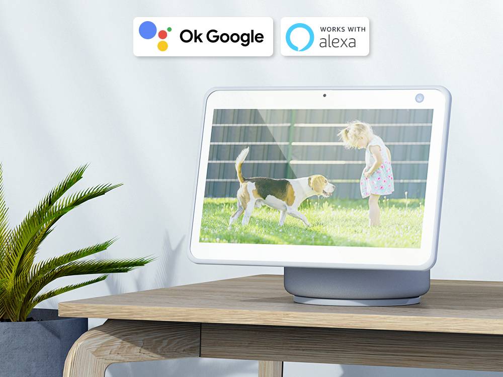 A smart speaker with a display shows a photo of a child and a dog in the garden. Top left, icons for 'Ok Google' and 'Works with Alexa'.