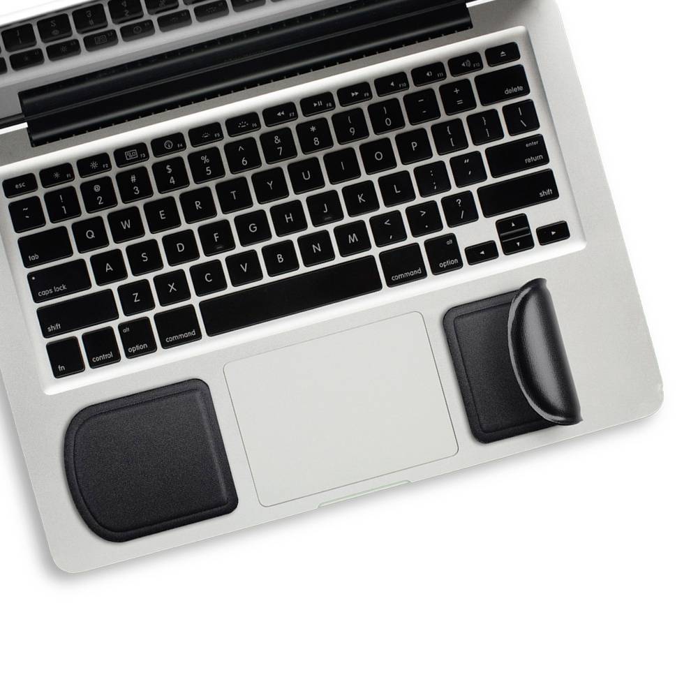 Laptop with a black keyboard and trackpad, two ergonomic wrist rests made of black material in front of the trackpad.